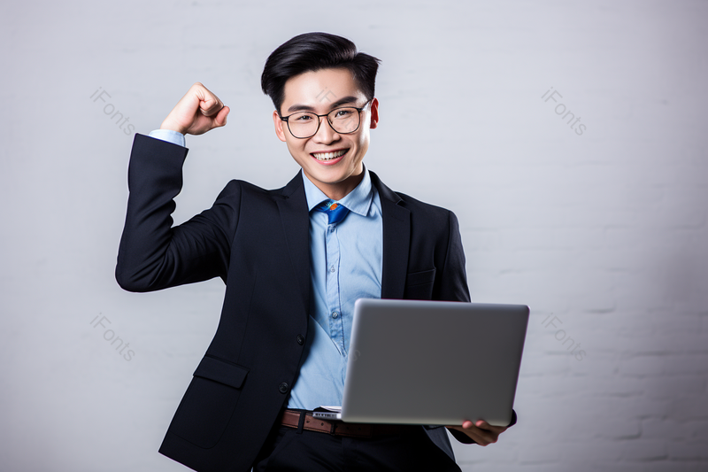 商务男士拿着电脑庆祝成功,高清,摄影图,摄影图片,图片大全,摄影图免费下载
